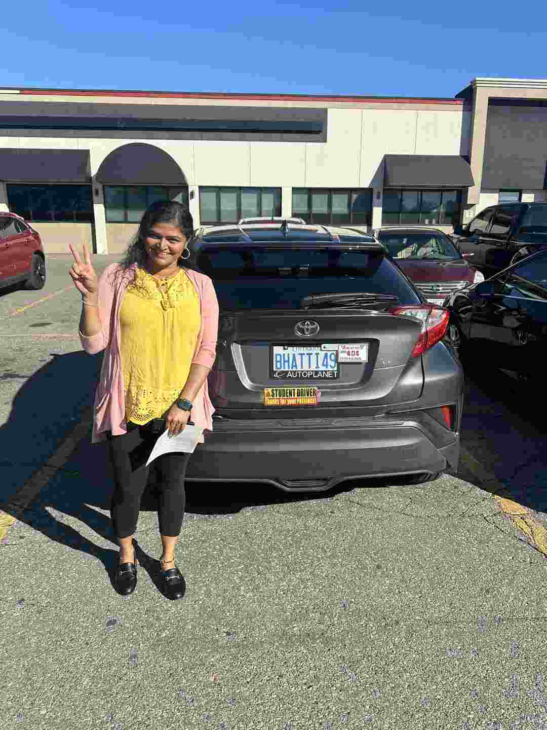 girl holding a driving licence certificate (Drive Vision School Training)